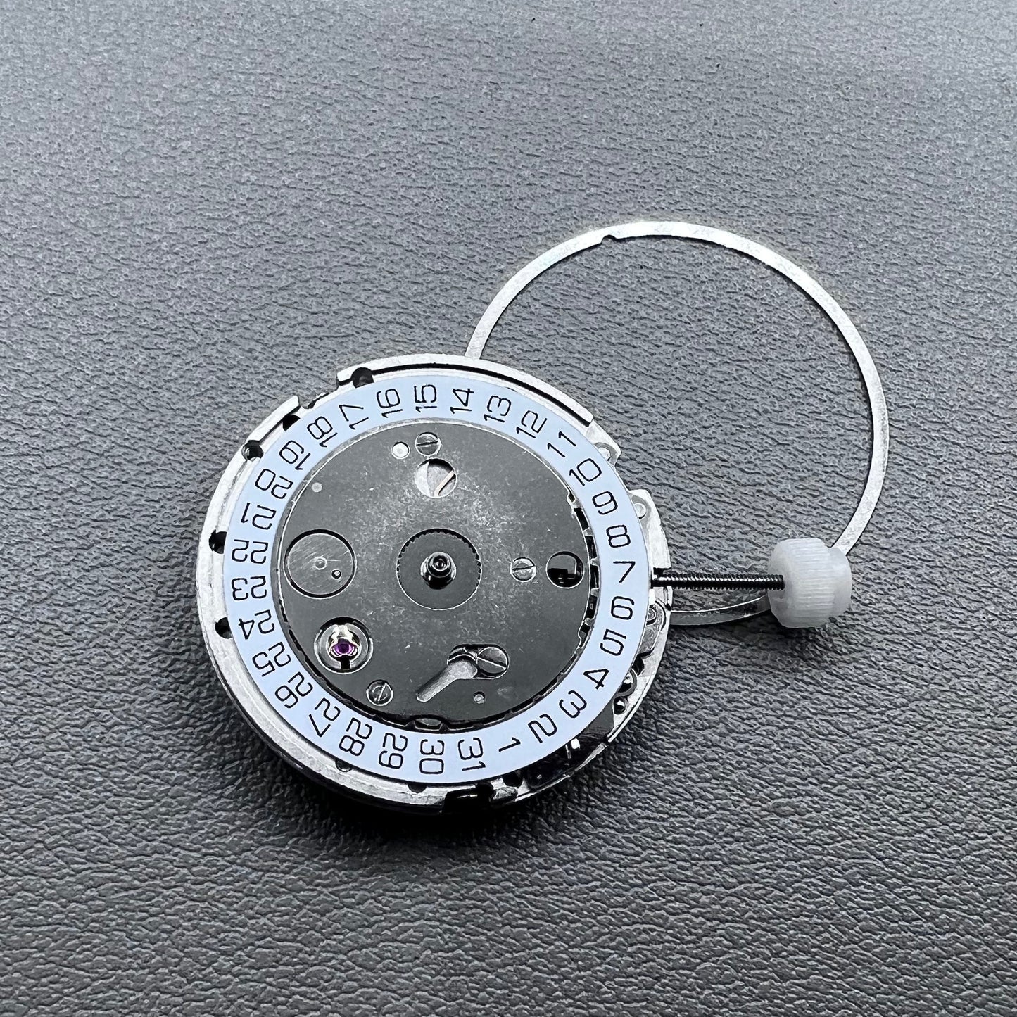Silver plated DG2813 automatic watch movement with large and small hands, date display at 3 o'clock
