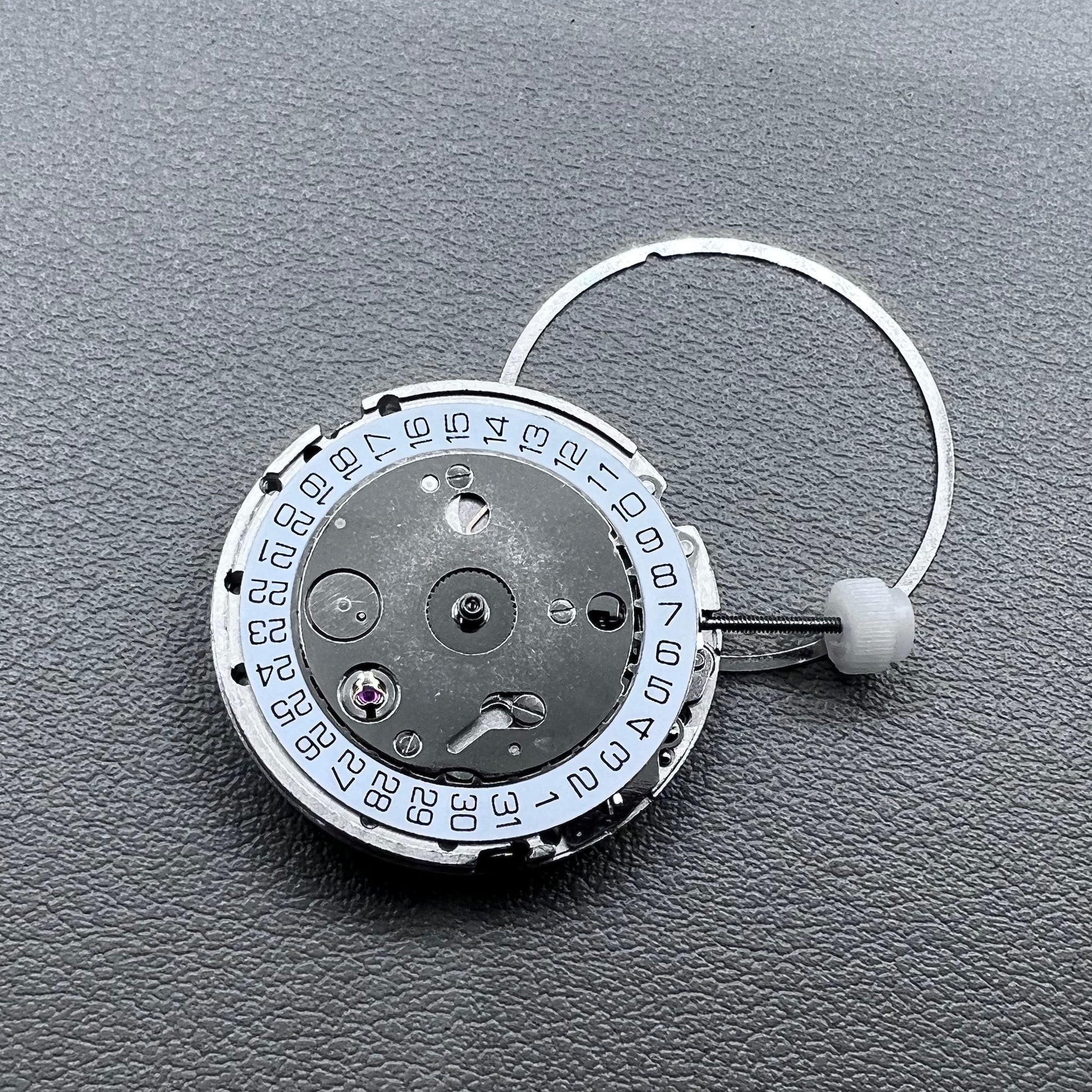 Silver plated DG2813 automatic watch movement with large and small hands, date display at 3 o'clock