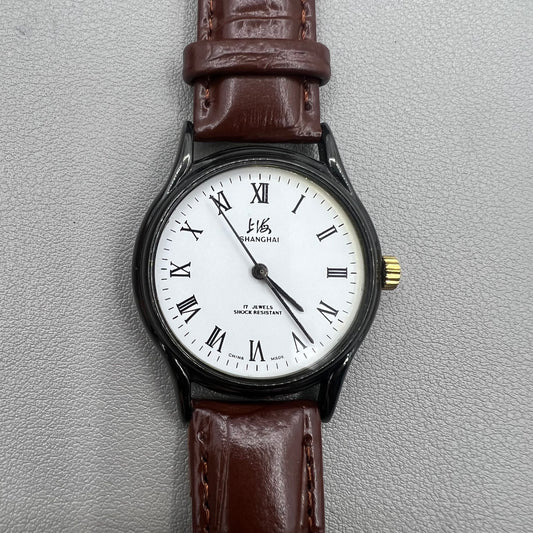 Shanghai 37mm manual mechanical watch with brown leather strap, Roman numerals, 17 jewels, classic style.