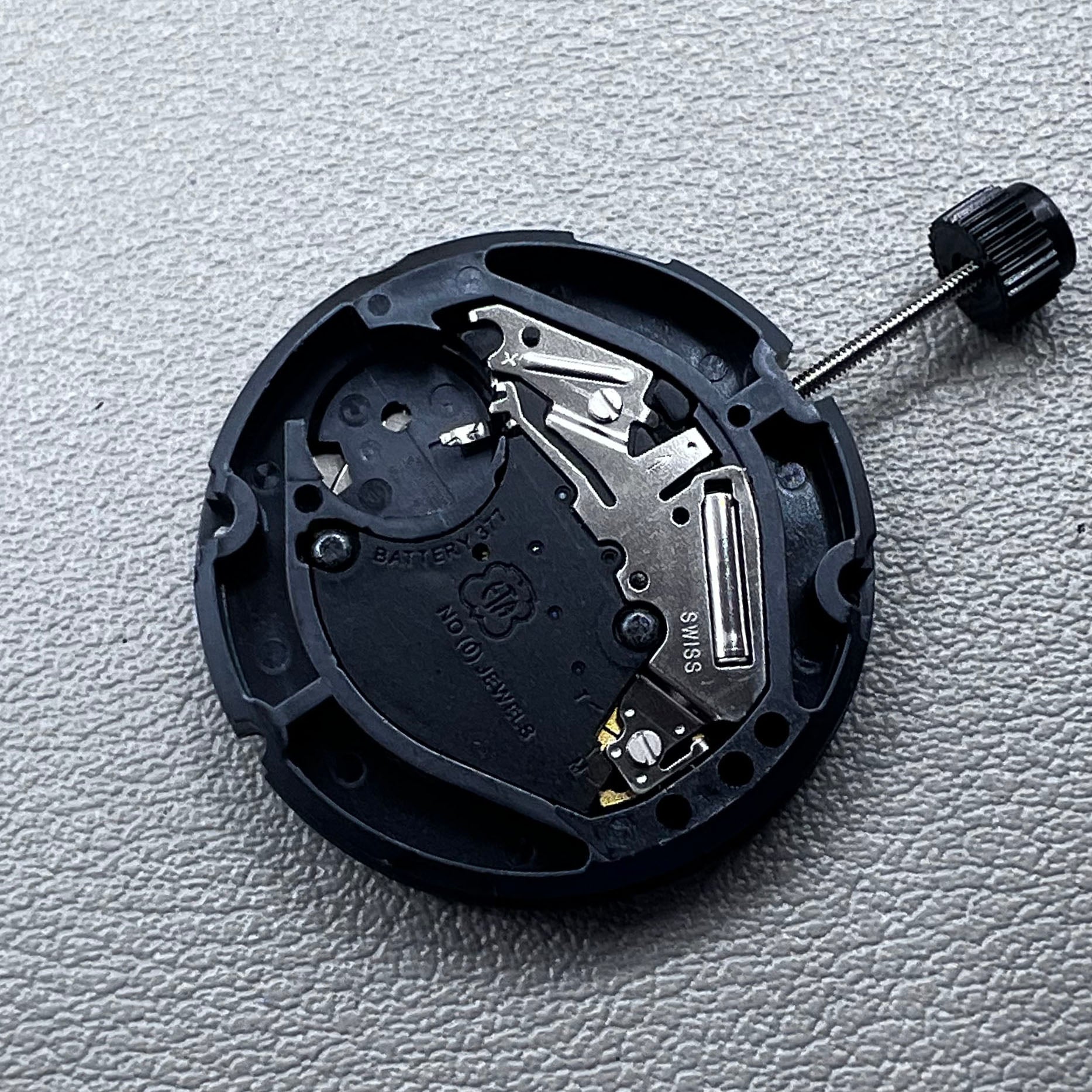 Swiss ETA 804.112 quartz watch movement showing precise 3 hands mechanism for accurate timekeeping.