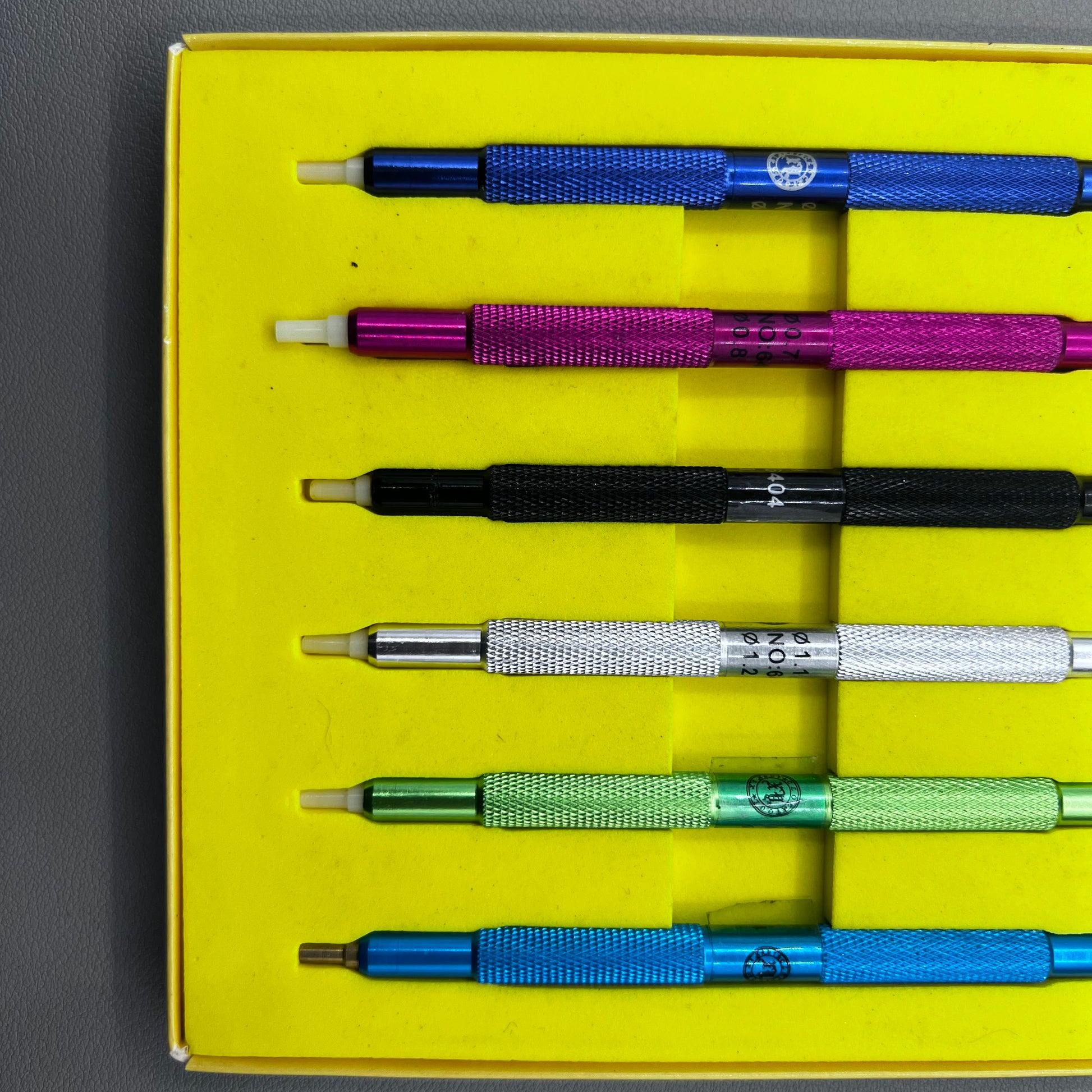 Set of 6 watch hand pressers for precise watch hand fitting and repair tools.