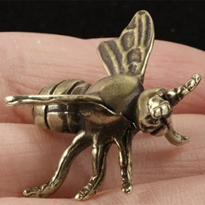 Hand-carved solid copper bee trinket in vintage bronze finish, perfect for watch accessory display.