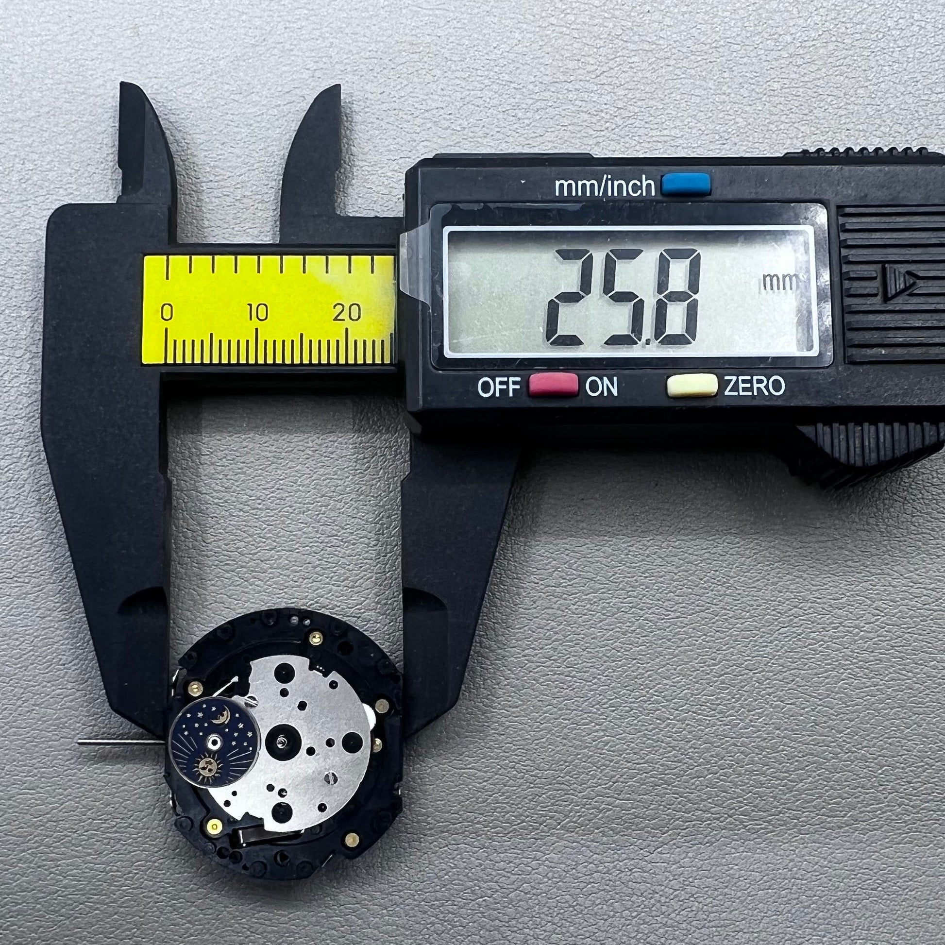 Original Japan VD59 watch movement close-up showing multifunctional quartz small second at 6/9/12 o'clock positions.