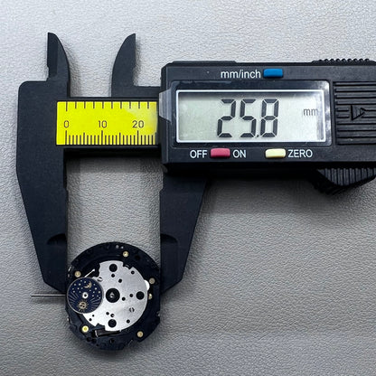 Original Japan VD59 watch movement close-up showing multifunctional quartz small second at 6/9/12 o'clock positions.