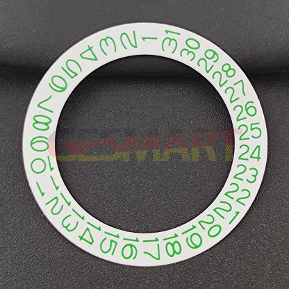 Close-up of NH35 NH36 watch movement with green date wheel on white background