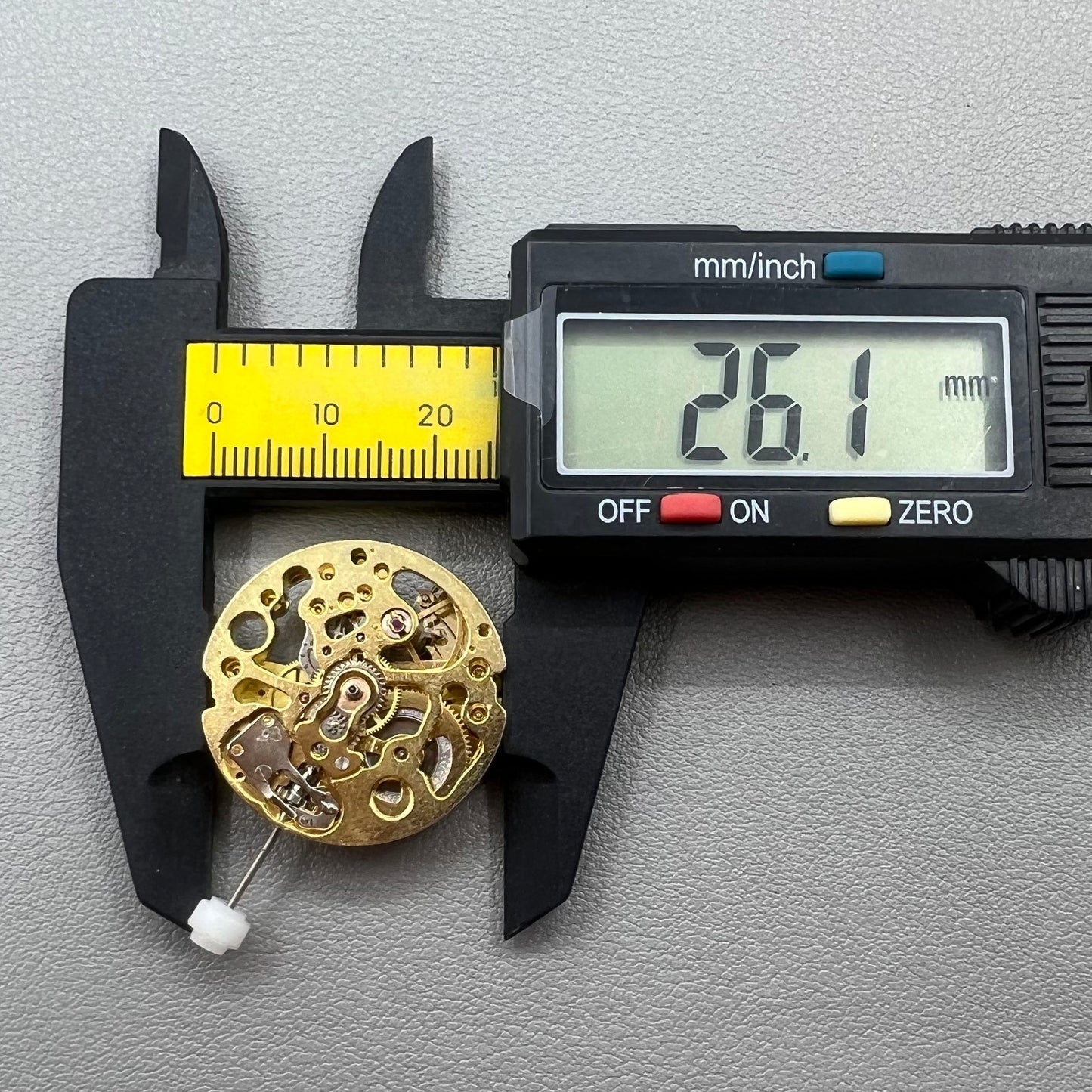 Golden 26.5mm hollow carved watch accessory with automatic 7120 mechanical movement, precision-engineered.