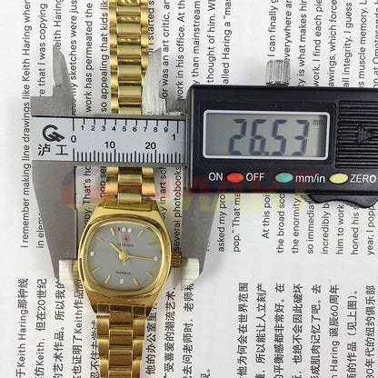 TAISHAN elegant lady watch with 19 jewels, golden case, and imitation diamond hour markers for stylish wear.