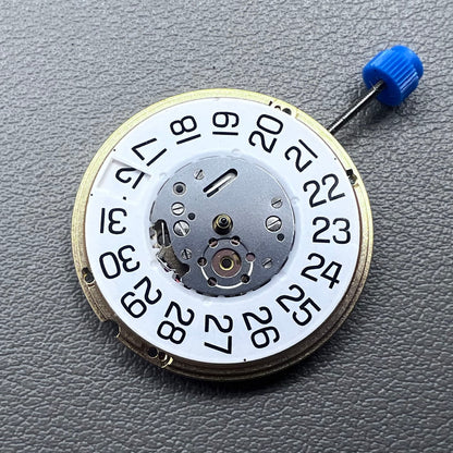 Swiss ETA F06.161 quartz watch movement with white dial, 3 hands, and date at 3 o?clock for precise timekeeping.