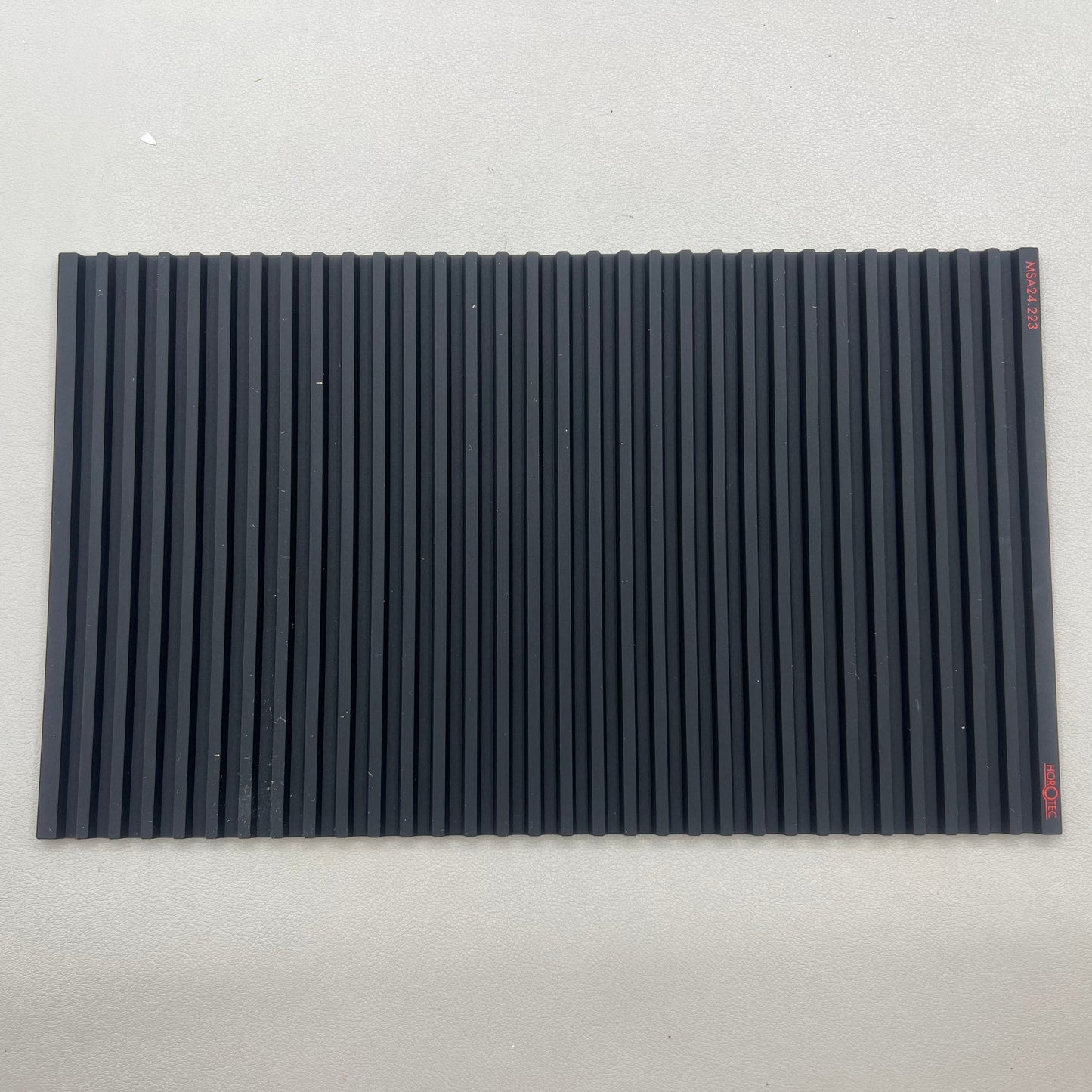 Swiss Horotec MSA24.223 black silicone anti-slip workbench mat with 32 compartments for watch accessories organization