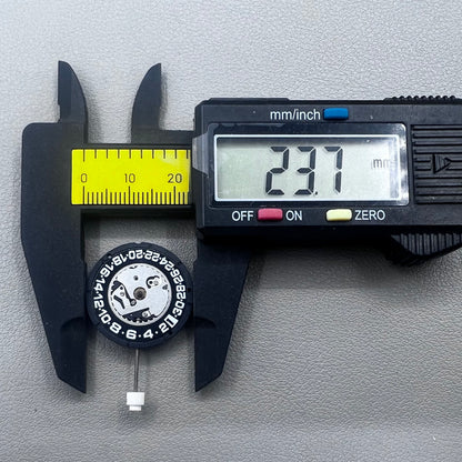Swiss ISA 2330 quartz watch movement with black font date at 6 o'clock, precise 3-hand accessory.