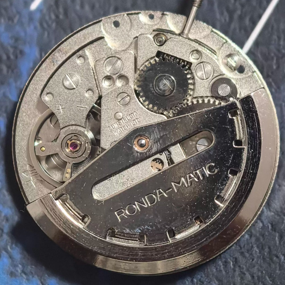 Swiss Made ETA1219 CAL1219 mechanical watch movement with white calendar display for precision timekeeping.