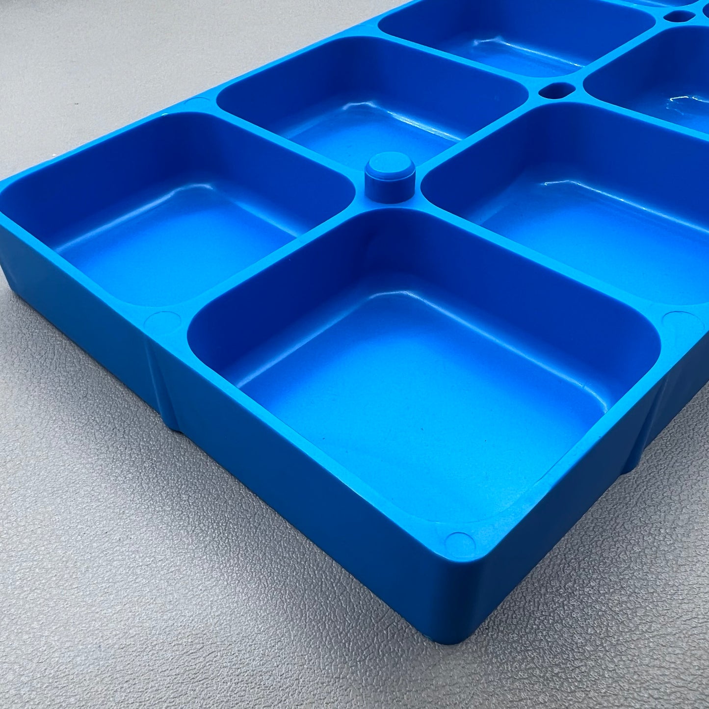 Swiss Horotec MSA17.530-B blue plastic watch accessory container with 10 compartments for organized storage.