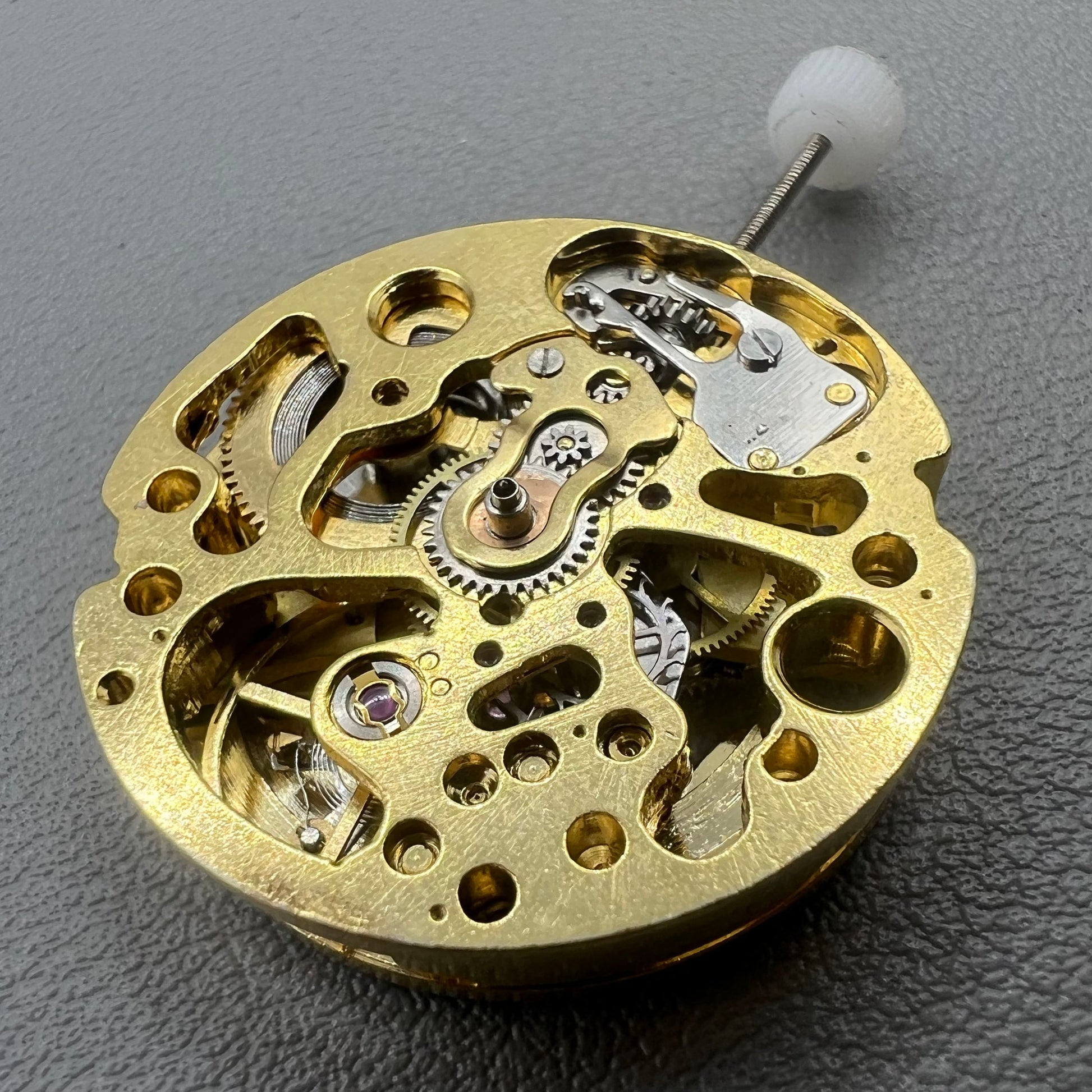 Golden 26.5mm hollow carved watch accessory with automatic 7120 mechanical movement, precision-engineered.