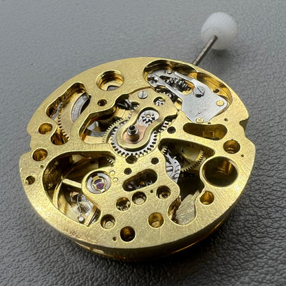 Golden 26.5mm hollow carved watch accessory with automatic 7120 mechanical movement, precision-engineered.