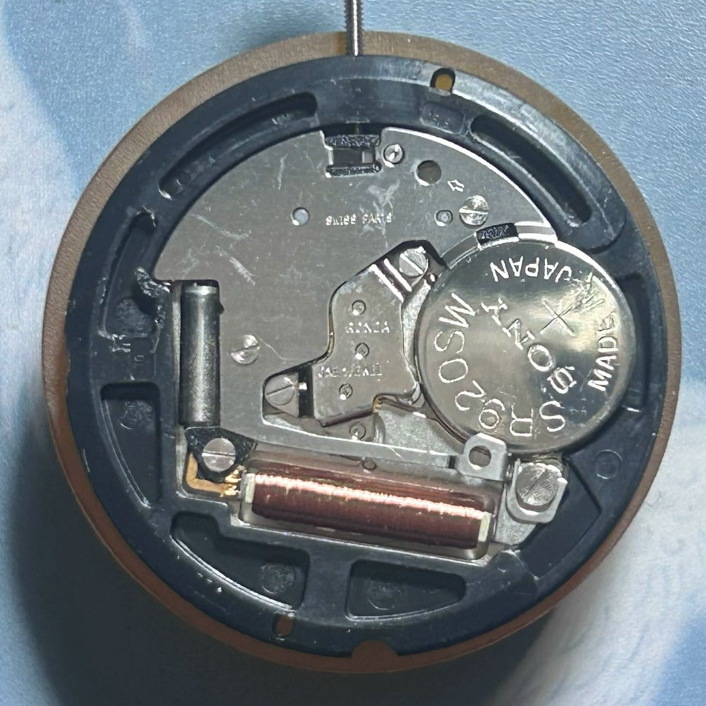 Disassembled Ronda 515B quartz movement showing Swiss precision with 3 hands and double calendar date at 6