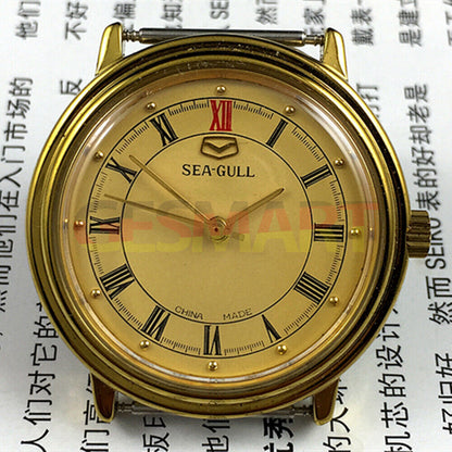 35mm round golden Tianjin Seagull watch with manual mechanical movement and elegant golden dial.