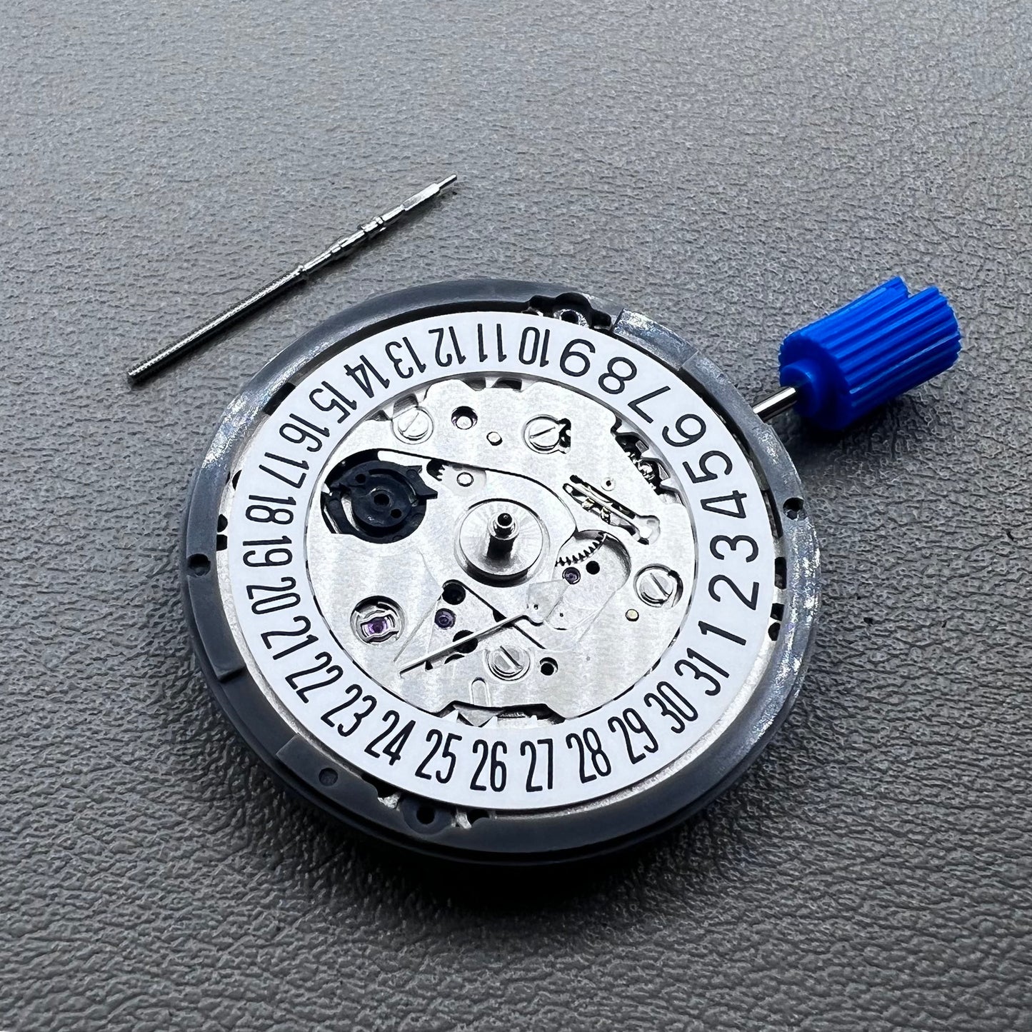 Seiko NH35A watch movement with black dial, 24 jewels, and date display at 6 o'clock for watch repairs.