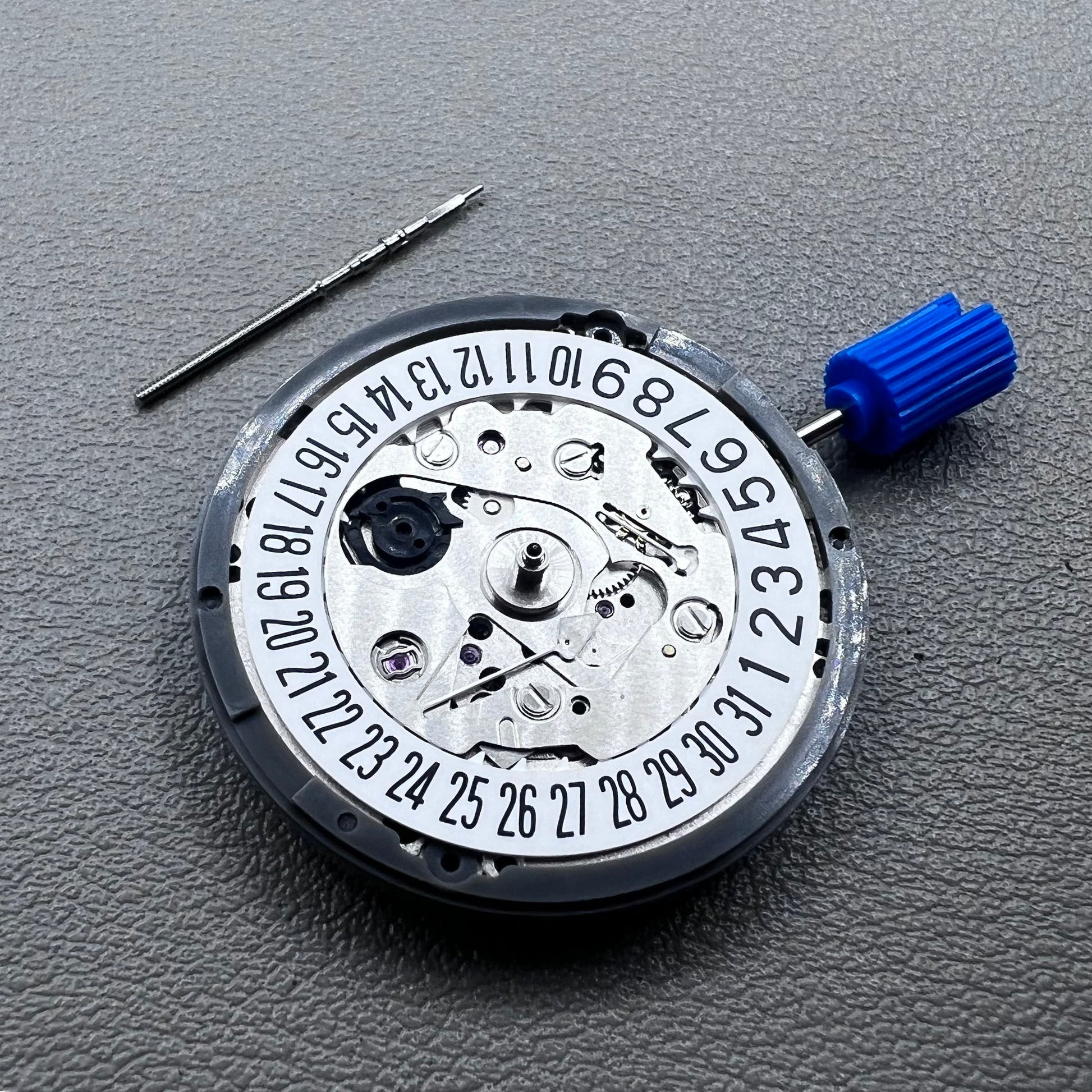 Seiko NH35A watch movement with black dial, 24 jewels, and date display at 6 o'clock for watch repairs.