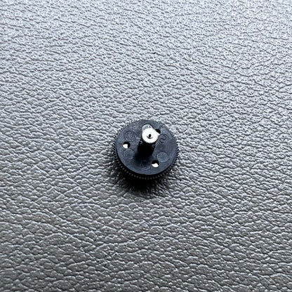 Black counting wheel for ETA C01.211 watch movement, precision replacement part for watch repair.