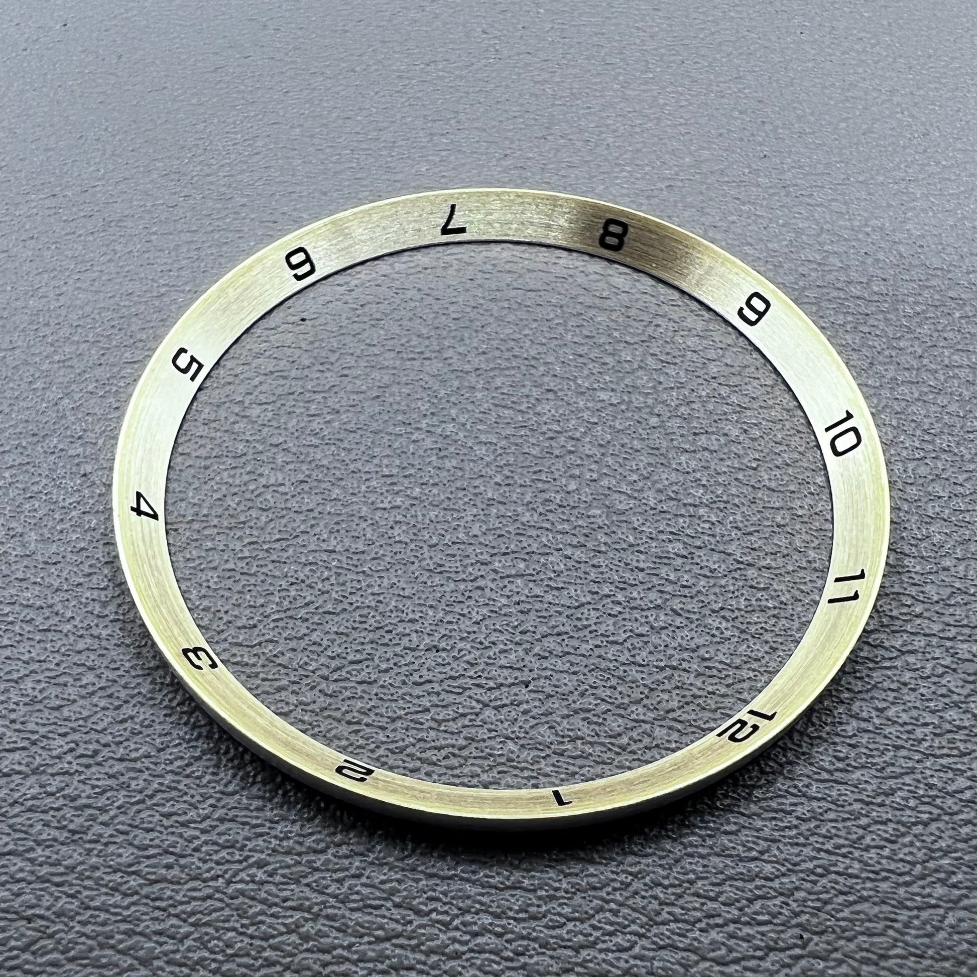 Golden stainless steel chapter ring for watches, 34.9x31.0x1.9mm, durable accessory.