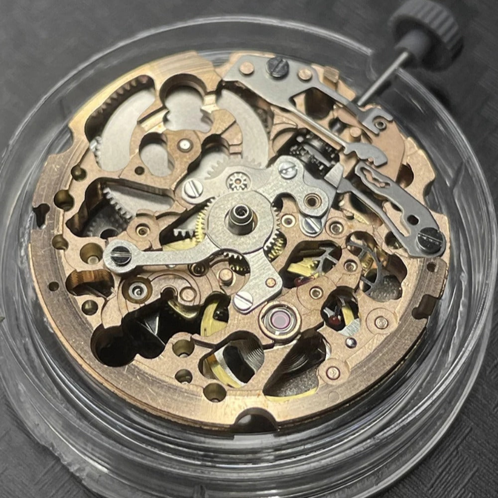 Miyota 8N24 automatic watch movement with rose gold and silver skeleton design, Japan-made precision craftsmanship.