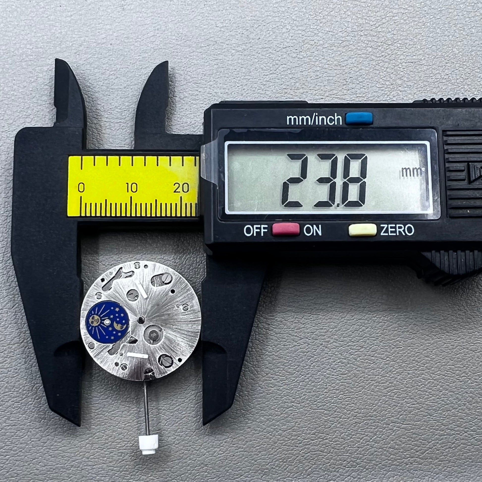 Swiss ISA 9231 Quartz watch movement with star moon phase display at 6 o'clock, precision craftsmanship.