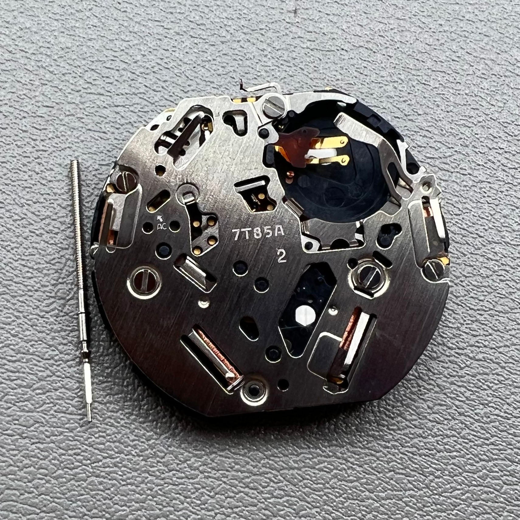 Seiko 7T85A quartz watch movement, precise craftsmanship made in Japan for reliability.