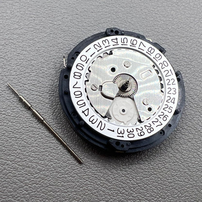 Seiko 5M85A quartz watch movement close-up, precise mechanism for reliable timekeeping by Seiko.