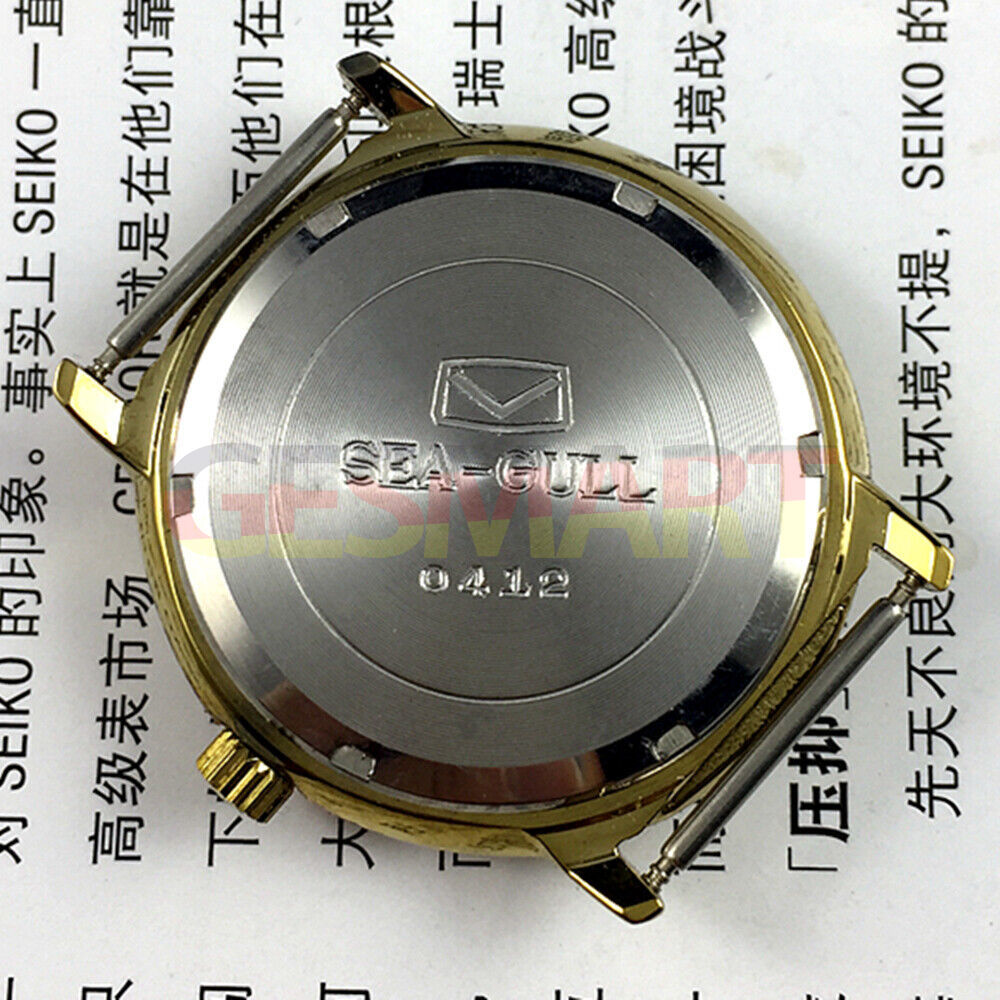 35mm golden case Tianjin Seagull watch with round dial, manual mechanical movement, classic design.