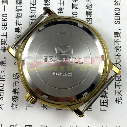 35mm golden case Tianjin Seagull watch with round dial, manual mechanical movement, classic design.