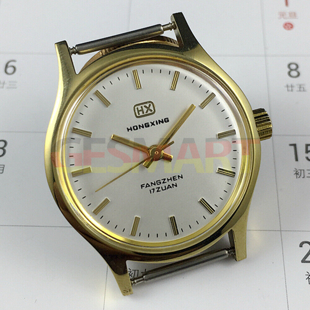 33mm Chinese manual mechanical watch with golden nails, silver dial, round golden case.