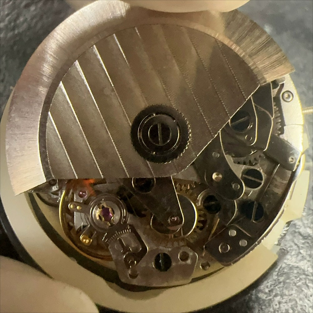 Shanghai 7750 mechanical watch movement with multifunctional white dial, 11mm height, precision Chinese craftsmanship.