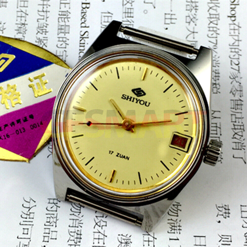 33mm Chinese manual mechanical watch with golden dial, single calendar, round case for elegant style.