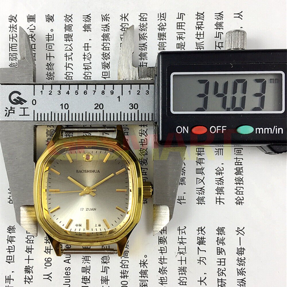 32mm Shanghai manual watch with golden markers and brown dial in octagonal stainless steel case.