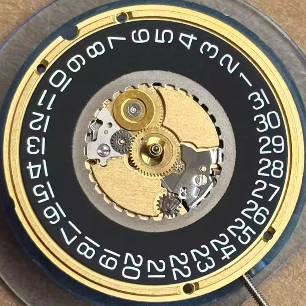 Swiss Made ETA955.412 quartz watch movement with 3 hands and black date disk at 3 o'clock.