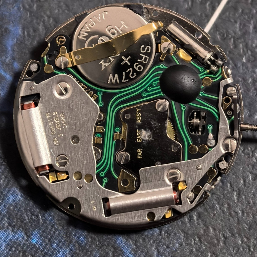 Swiss ISA 8171A quartz watch movement with 6 hands and white date disk at 4 o'clock, ideal for repairs.