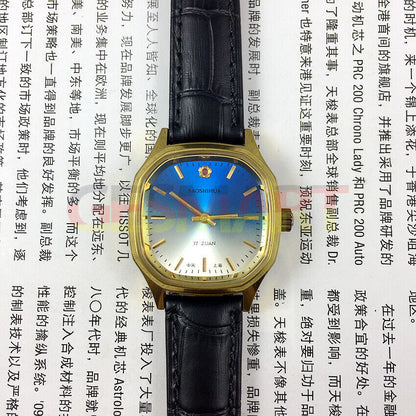 33mm Shanghai manual mechanical watch with blue dial, square case, and gold markers by Shanghai.