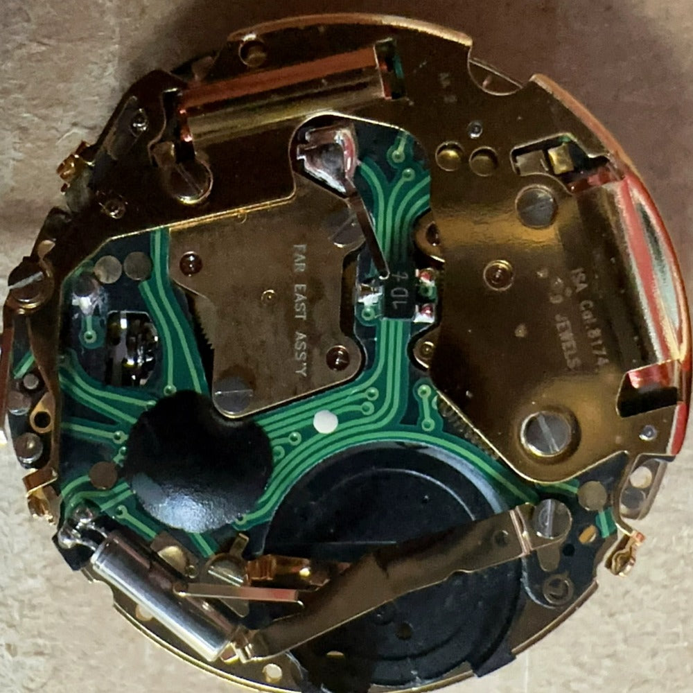 Swiss Made Golden ISA 8174 alarm clock with quartz movement, 6 hands, and sound pad for precise timekeeping.