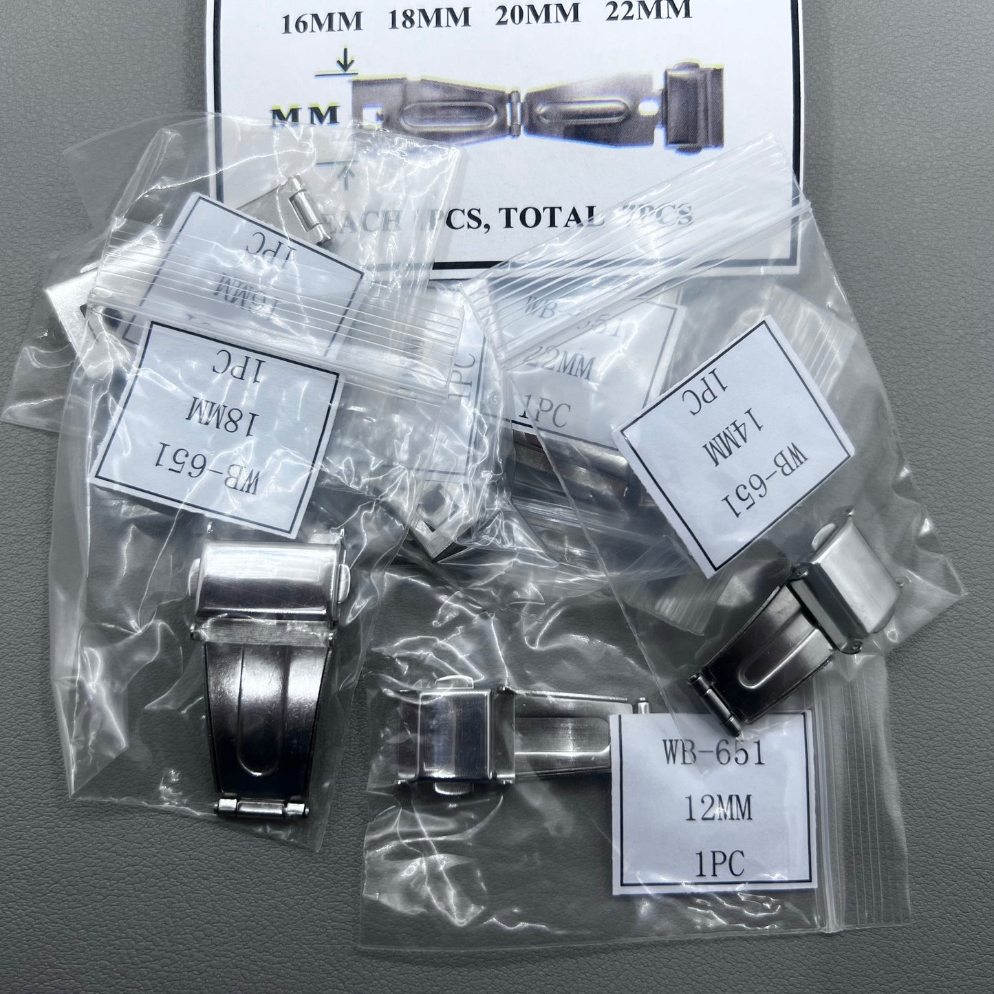 Set of 7 silver stainless steel watch buckles, 10-22mm, polished double-sided for secure clicks.