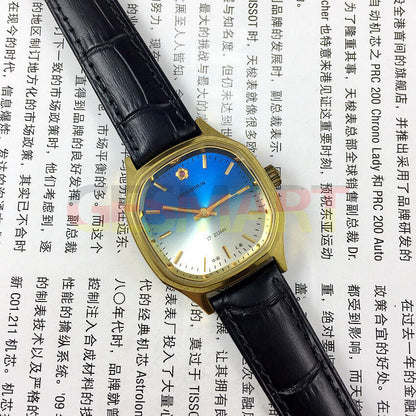 33mm Shanghai manual mechanical watch with blue dial, square case, and golden nail markers, 17 jewels.
