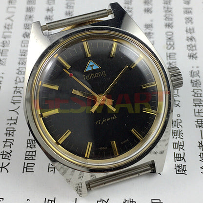 Chinese Taihang 32mm manual mechanical watch featuring 17 jewels, black dial, and golden nail markers for classic style.