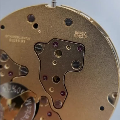 Ronda 5022.B Swiss quartz movement with golden gilted finish, ideal for watch repairs and accessories.