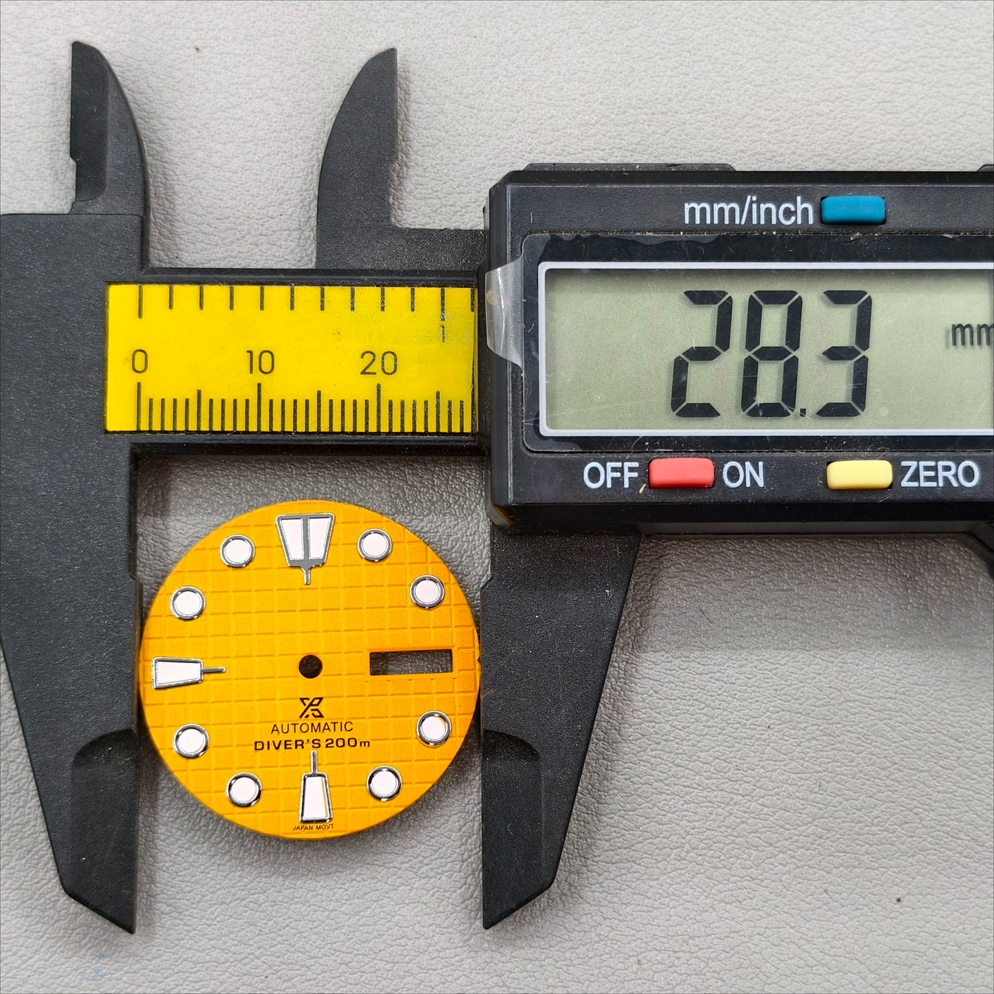 watch dial with S logo