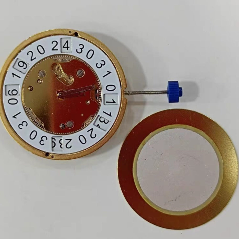 Swiss Made Ronda 5130B quartz movement watch with gold-tone case and date display at 12 o'clock.