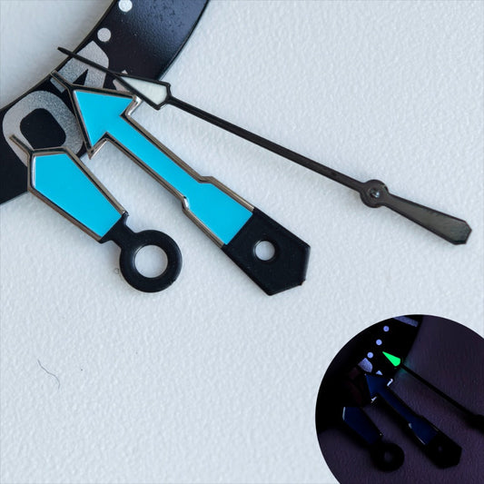 Dark silver-trimmed blue and black watch hands with green lume for NH35/36 movements, enhancing visibility.