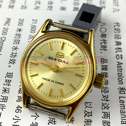 Seagull 26mm ladies watch with golden case, manual movement, and brown leather strap for elegant style.