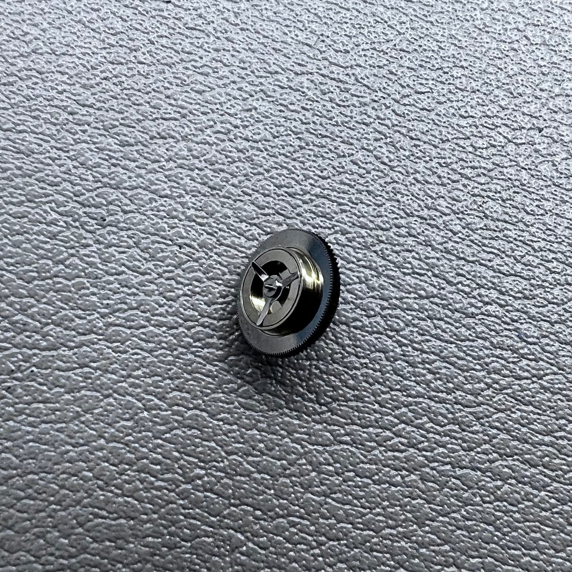 Black counting wheel for ETA C01.211 watch movement, precision replacement part for watch repair.
