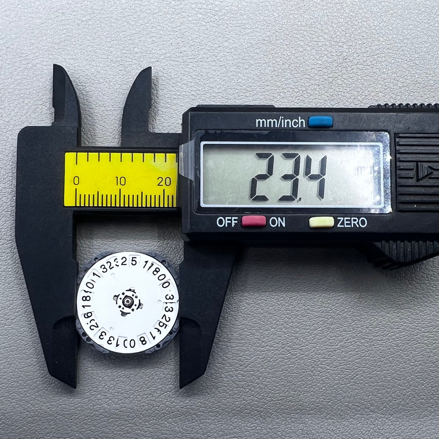 Japan Hattori VJ76B quartz watch movement with date display at 12 o'clock position, precise timekeeping.