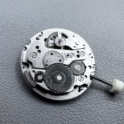 Disassembled Swiss RONDA MATIC 1217-21 manual winding watch movement showcasing intricate components.