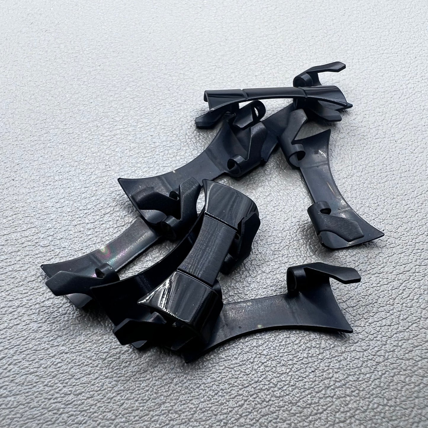 1. Six steel black matte curved end links with spring bars for durable watch band straps.  
